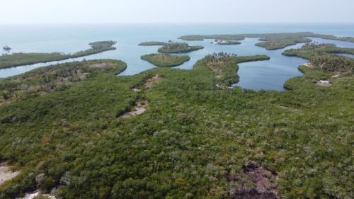 an aerial view of islands in a body of water at Santa Lova Eco-hostel Isla Tintipan in Tintipan Island