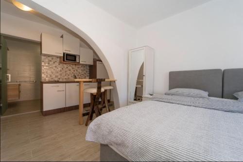 Ένα ή περισσότερα κρεβάτια σε δωμάτιο στο Rooms & Apartments Mirakul