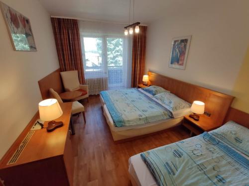Postel nebo postele na pokoji v ubytování Penzion Aktiv