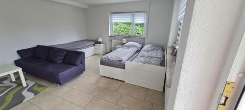 Postel nebo postele na pokoji v ubytování Ferienwohnung im Grünen