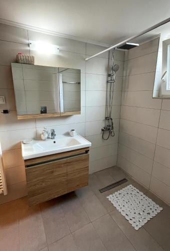a bathroom with a sink and a mirror at Casa di Sole in Nikiana