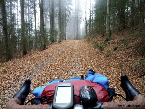 a person riding a motorcycle down a dirt road at Pension Aspen in Železná Ruda