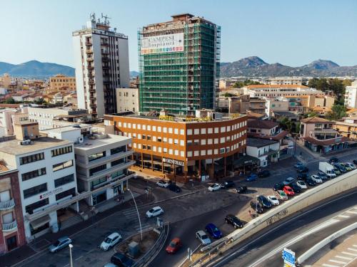 an aerial view of a city with tall buildings at Hotel De Plam in Olbia