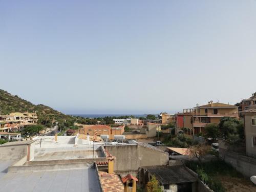a view of a city from the roof of a building at Domo Green House in Villasimius