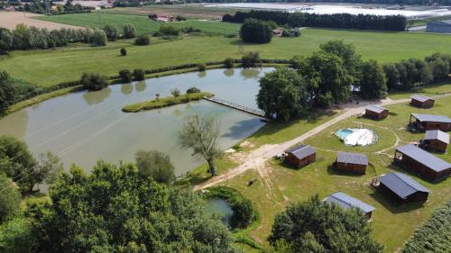 an aerial view of a farm with a lake at Studio Domaine du vieux chêne in Bergerac