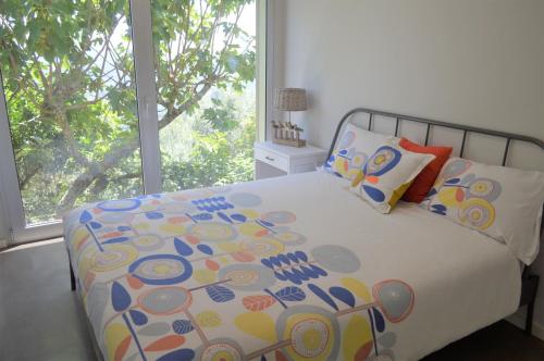 Postel nebo postele na pokoji v ubytování Casa do Eido dos Calhões