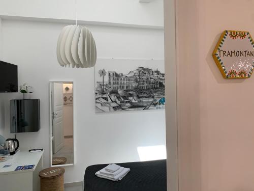 TV a/nebo společenská místnost v ubytování L'Ancora B&B