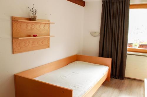 Postel nebo postele na pokoji v ubytování Haus Ganeu