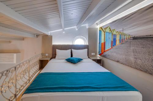 A bed or beds in a room at La Brezza Suite & Hotel