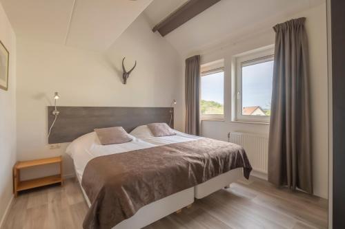 Posteľ alebo postele v izbe v ubytovaní Fleurie de Montagne