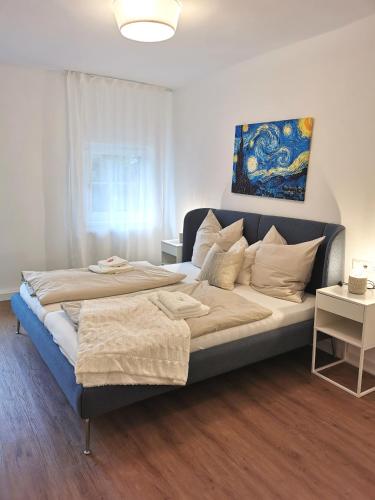 a bedroom with a large bed in a room at Ferienhaus Theodor OG in Laufen