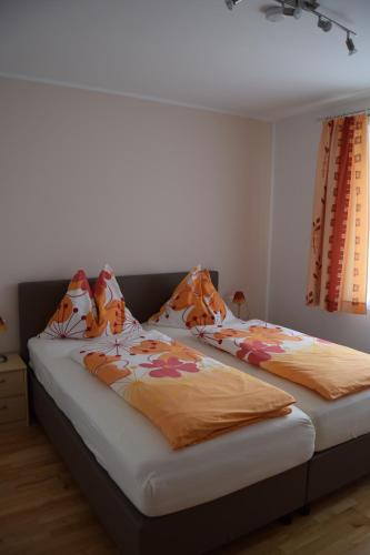 Ένα ή περισσότερα κρεβάτια σε δωμάτιο στο Ferienwohnungen Valerie