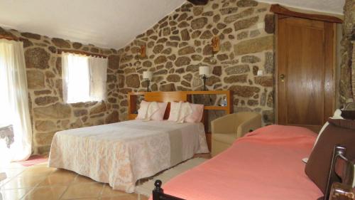 Cama ou camas em um quarto em Quinta da Ribeira