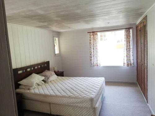 Llit o llits en una habitació de Lago Llanquihue Casa playa Ensenada