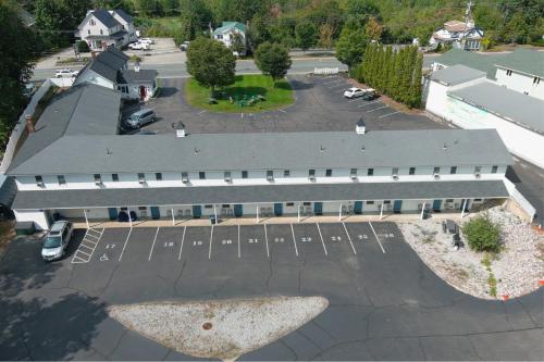 an aerial view of a building with a parking lot at Colonial Motel in North Conway