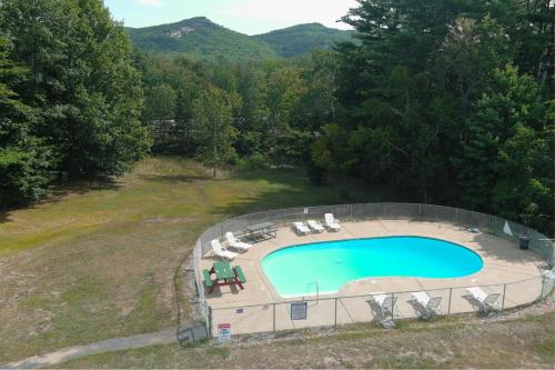 an overhead view of a swimming pool in a field at Colonial Motel in North Conway