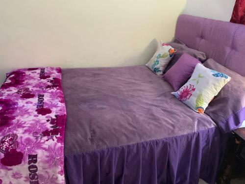 
A bed or beds in a room at Higuey Center City
