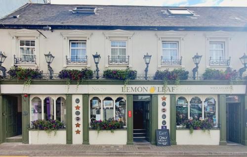a large building with a large window on the side of it at The Lemon Leaf Café Bar and Townhouse in Kinsale