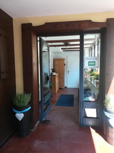 an entrance to a building with a door open at Apartmenthaus WALDHORN in St. Wolfgang