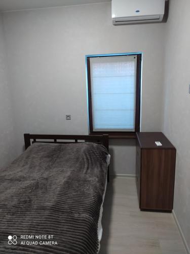 Ένα ή περισσότερα κρεβάτια σε δωμάτιο στο REEF APARTMENTS
