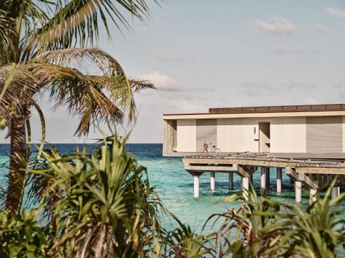a house on a pier on the water at Patina Maldives, Fari Islands in North Male Atoll
