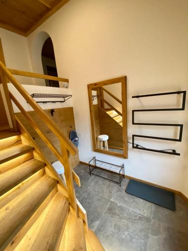 a room with a staircase and a mirror at Apartment Moosbach in Fieberbrunn