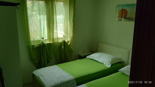 Ένα ή περισσότερα κρεβάτια σε δωμάτιο στο Apartment Mistral