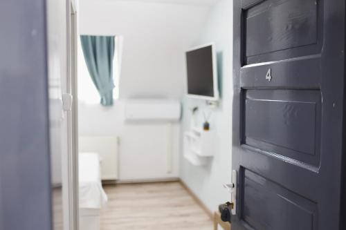 Μια τηλεόραση ή/και κέντρο ψυχαγωγίας στο Apart Hotel Fresh