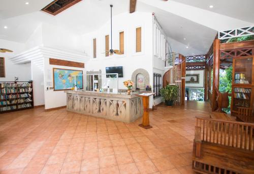 a large room with a counter in a building at Oceanfront Hotel Verde Mar direct access to the beach in Manuel Antonio