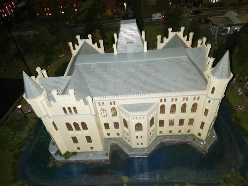 a model of a white building with a roof at Ediths Haus in Rhauderfehn