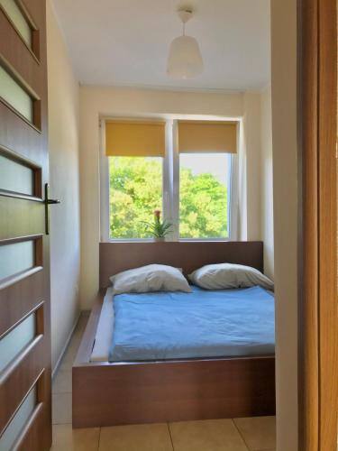 Posteľ alebo postele v izbe v ubytovaní CENTRUM