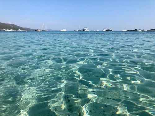 a large body of water with boats in the background at Island Residence in Sali