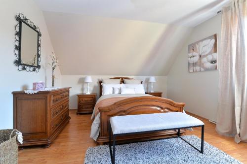 Voodi või voodid majutusasutuse Au Pied du Vignoble toas