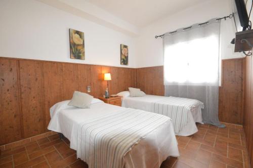 Posteľ alebo postele v izbe v ubytovaní Habitaciones Baleares