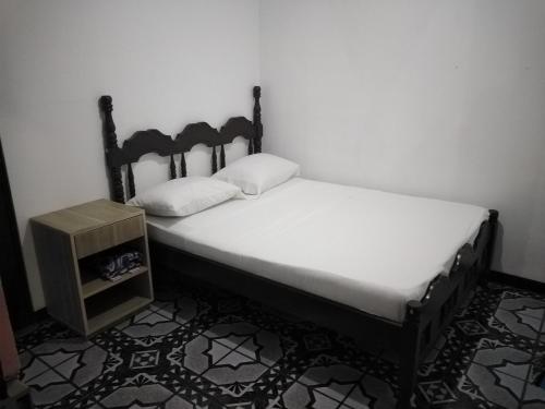 Una cama o camas en una habitación de Hostel Orozco - Costa Rica