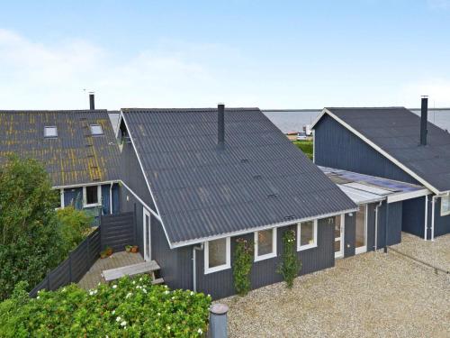 a row of houses with roofs at 6 person holiday home in Hemmet in Falen