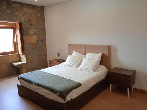 Ένα ή περισσότερα κρεβάτια σε δωμάτιο στο Quinta do Passadiço