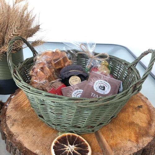 a basket sitting on top of a piece of bread at COSY APPART in Contrexéville