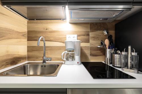 Kuchyň nebo kuchyňský kout v ubytování Art Central Suites