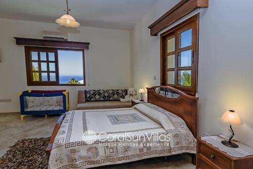 Katil atau katil-katil dalam bilik di PARADISE VILLA 413 by Coral Sun Villas