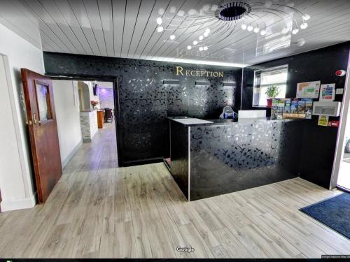 an office with a reception counter in a room at County Hotel in Helensburgh