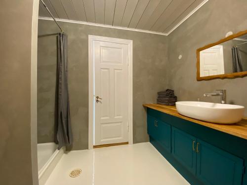 a bathroom with a sink and a toilet and a shower at N1 Apartment in the heart of Højer in Højer
