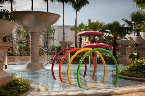 a fountain with colorfulools in the middle of a pool at Banyan Tree Macau in Macau