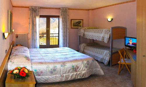 Posteľ alebo postele v izbe v ubytovaní Hotel Les Saisons