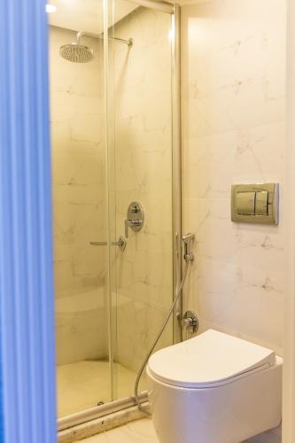 a bathroom with a shower and a toilet at Riva Hill Resort Lankaran in Lankaran