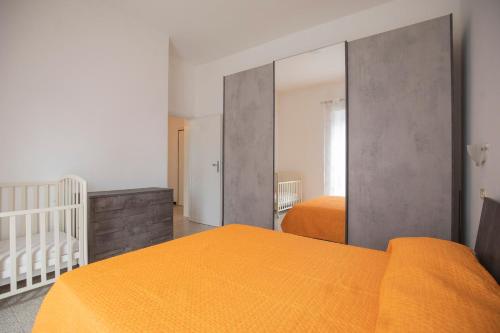 Postel nebo postele na pokoji v ubytování Appartamento Tamma 1 - HelloElba