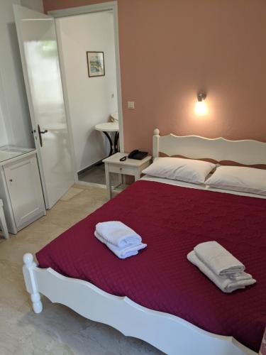 Ein Bett oder Betten in einem Zimmer der Unterkunft Hotel Omirico