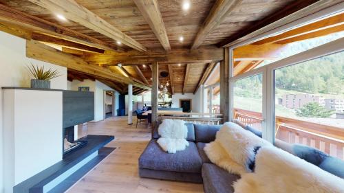 a living room with a couch and a fireplace at A Casa Kristall in Sölden