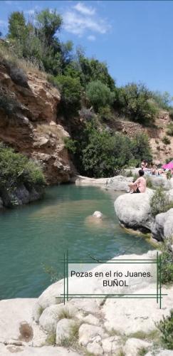 a sign that reads pagoges end of james bond in a river at Casa rural El Majuelo in Portera