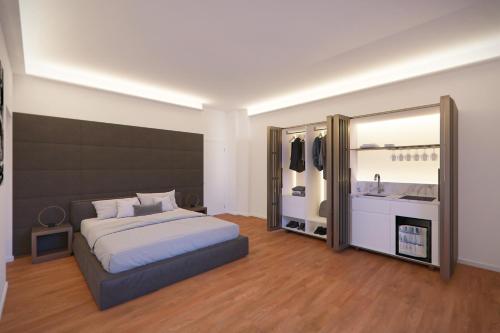 a bedroom with a bed and a large mirror at SCF Collection - Duomo in Milan